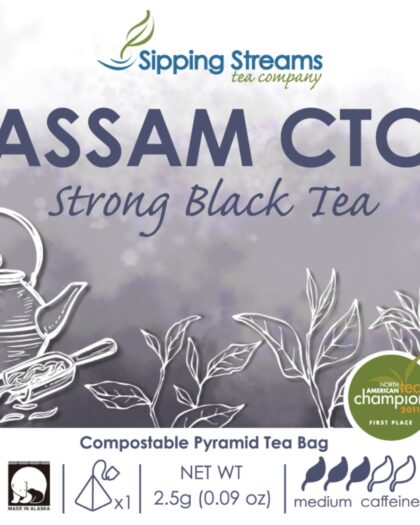 A wholesale box containing 50 individually wrapped pyramid tea sachets of Assam CTC black tea, designed for robust flavor and convenient single-serve brewing.