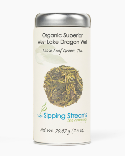 A tall tin filled with Organic West Lake Dragon Well green tea, showcasing its signature flat, hand-pressed leaves and premium Chinese green tea quality.