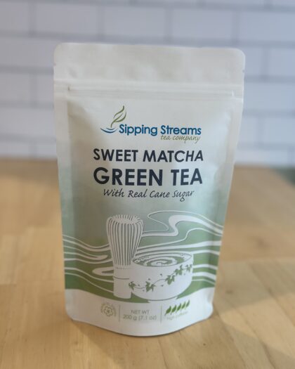 A 200g bag of Sipping Streams Tea Company's Sweet Matcha, featuring finely ground Japanese green tea that is pre-sweetened for a balanced, smooth, and naturally vibrant matcha drink. Ideal for matcha lattes, smoothies, and culinary creations, this blend delivers a rich, creamy taste with a hint of sweetness.