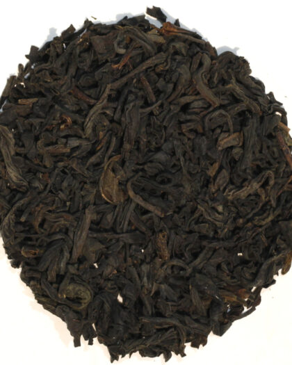 A wholesale 1 lb bag of Organic Lapsang Souchong black tea, featuring dark leaves infused with natural pinewood smoke for a distinctive, full-bodied cup.