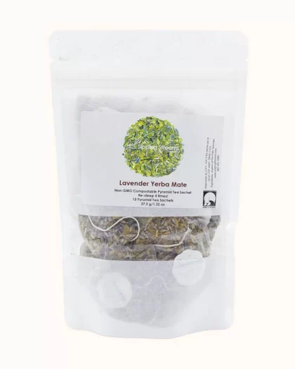 A clear, resealable bag of Sipping Streams Tea Company's Lavender Yerba Mate, containing 15 non-GMO compostable pyramid tea sachets. The label displays a vibrant green and lavender blend with product information, emphasizing re-steepable tea and eco-friendly packaging.