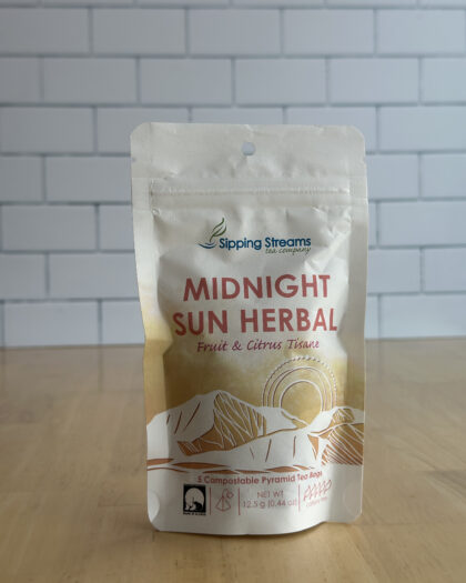 Small pouch of Midnight Sun Herbal Blend tea with 5 compostable pyramid sachets inside. A caffeine-free, colorful herbal blend inspired by Alaska’s midnight sun.