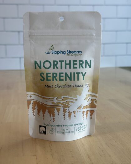 Small pouch of Organic Northern Serenity Herbal Tea with 5 compostable pyramid sachets. A caffeine-free blend of organic herbs and florals for a calming cup.