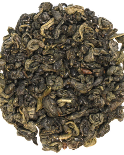 A wholesale 1 lb bag of Gunpowder loose leaf green tea, showcasing tightly rolled pellets that unfurl during steeping for a robust, full-bodied cup.