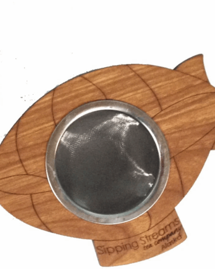 A Zeppelin-shaped wooden tea infuser with fine mesh basket, sold in a 12-count case. A handcrafted, eco-friendly tea accessory inspired by classic airship design.