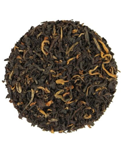 A wholesale 1 lb bag of Golden Tips Assam black tea, showcasing golden-tipped leaves prized for their bold flavor, natural sweetness, and full-bodied character.