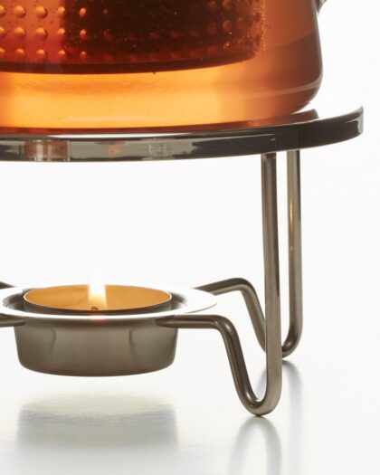 A Finum® stainless steel tea warmer, 140 mm diameter, used to maintain tea temperature during service.