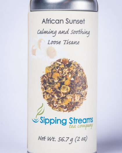 A tall retail tin filled with African Sunset herbal tea, featuring a rooibos-based blend known for its naturally sweet, smooth, and sunset-inspired flavor.