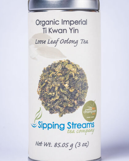 A tall tin of Organic Imperial Ti Kwan Yin Oolong showcasing its rolled leaves and premium Chinese oolong quality, known for floral, buttery, and smooth flavor notes.