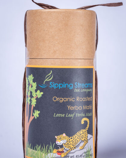 A tall retail tin filled with Organic Roasted Yerba Maté, featuring loose leaf maté with deep, roasted, coffee-like notes.